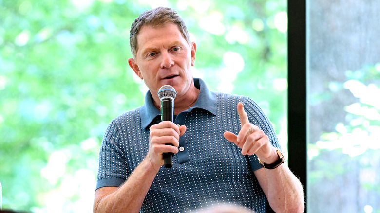 Bobby Flay speaking at a food event.