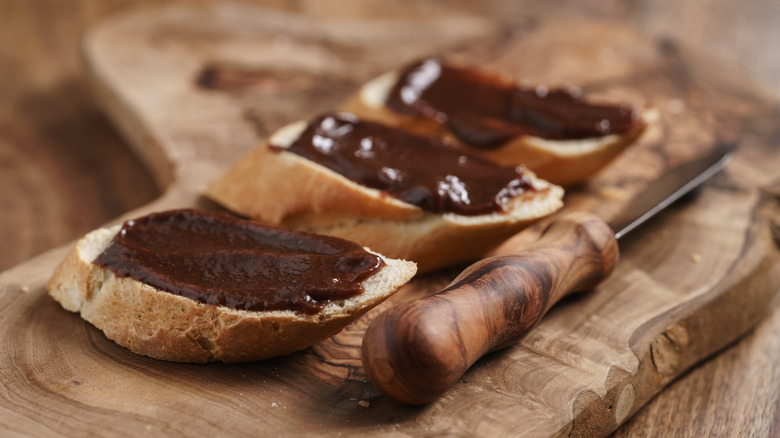 Gianduja spread on wooden cutting board