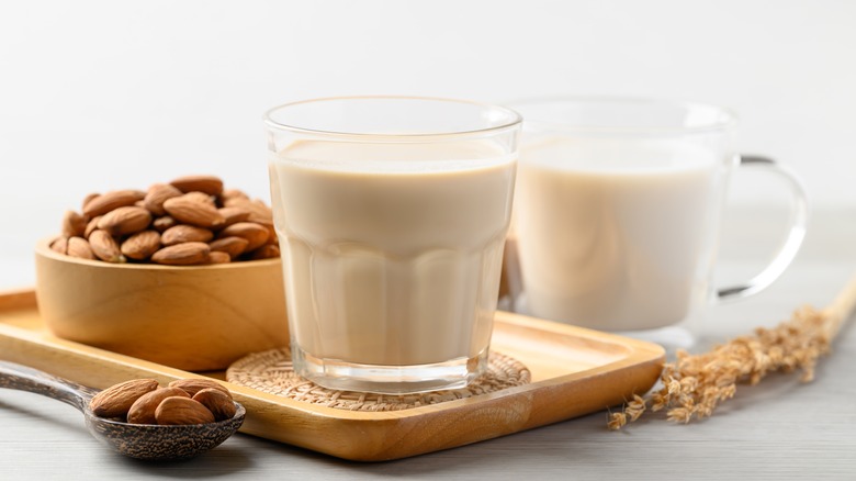 Two glasses of milk on table