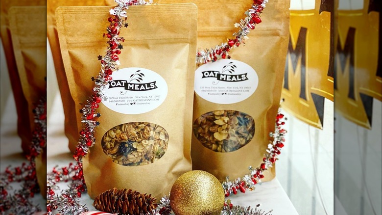 Bags of Oat Meals granola sit on a festive Christmas display