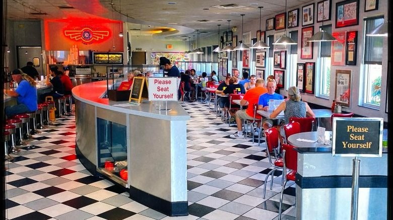 Camp Washington Chili interior showing people seated at tables and at the counter
