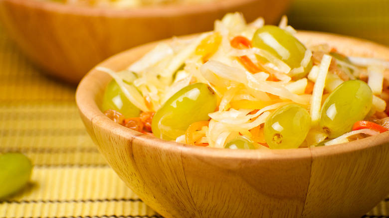 Salad with shredded cabbage, grapes, and raisins