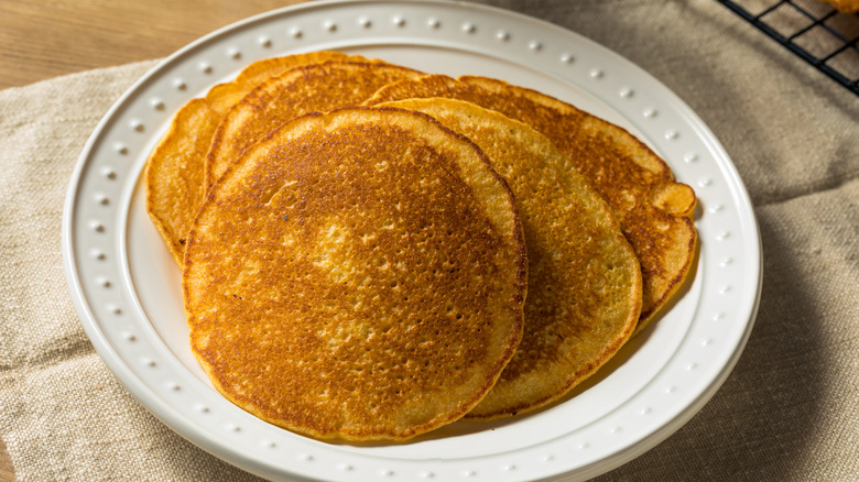 Corn meal cakes on white plate