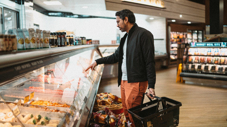 man ordering at a deli counter