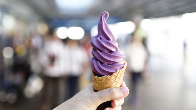 Purple ice cream swirled in cone