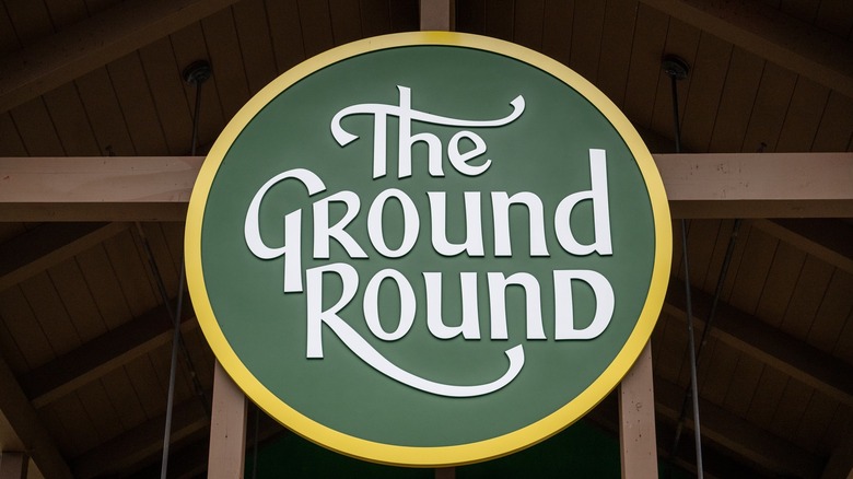 The Ground Round logo one a green background encircled by a golden ring