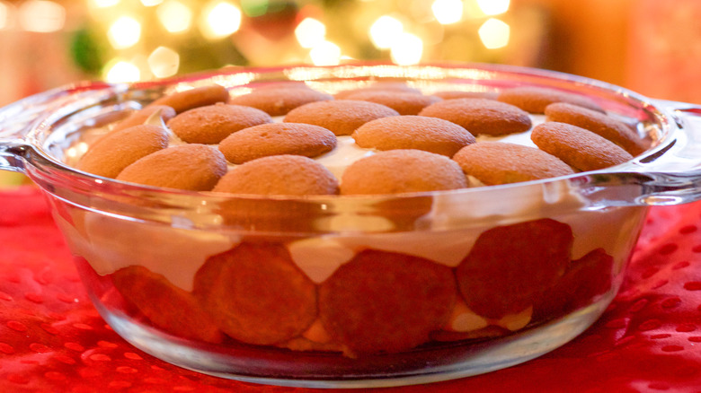Banana pudding in a glass dish with vanilla wafers