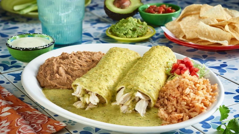 Enchiladas, chips, guac, and sides served at Chuy's