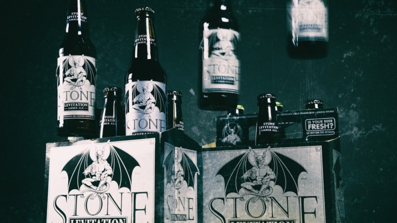 Bottles of Stone Brewing Levitation beer, with some in the air