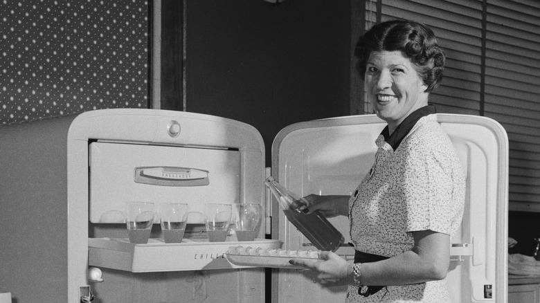 1950's era woman with refrigerator
