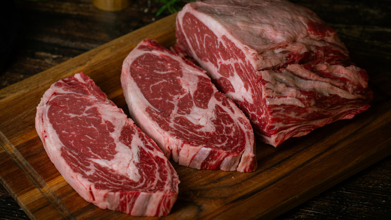 Ribeye steaks on a cutting board