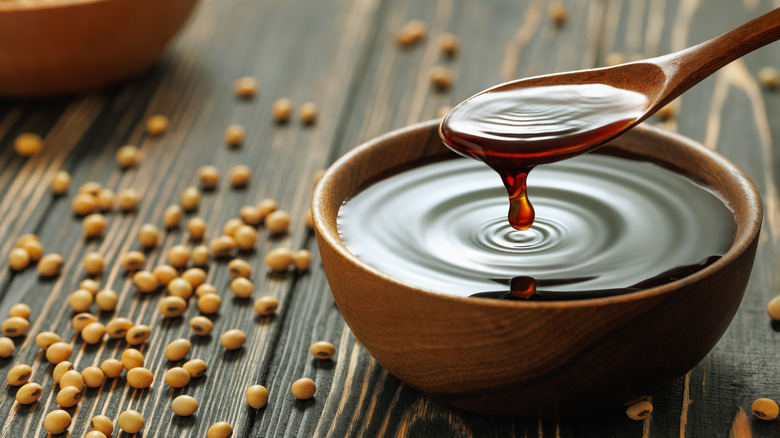 A small bowl filled with soy sauce.