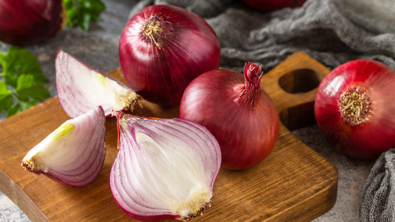 Whole and sliced red onions