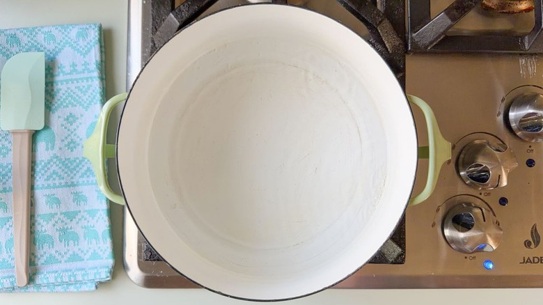 Saucepan with small amount of water heating on stovetop