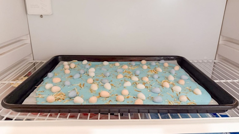 Pastel blue 3-ingredient Easter bark cooling in refrigerator on sheet pan