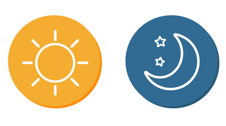 A day symbol in orange and a night symbol in blue on a white background