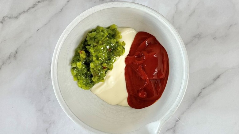 Relish, mayonnaise, and ketchup in bowl