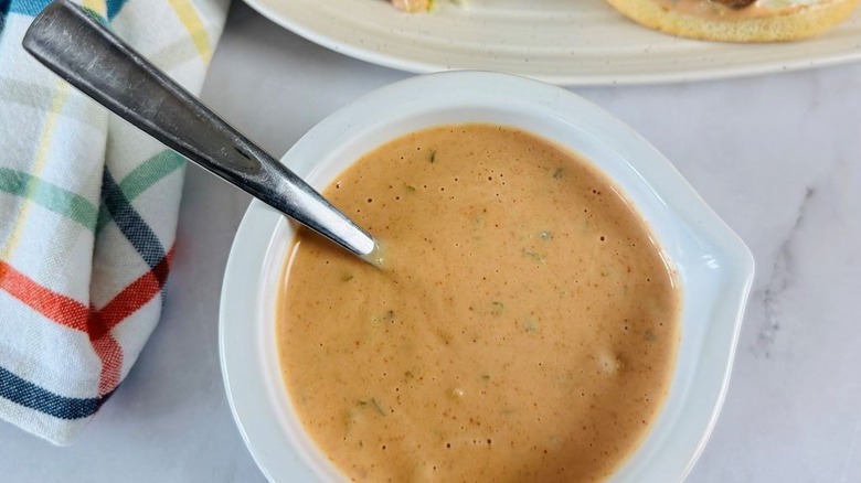Bowl of burger sauce with spoon in it