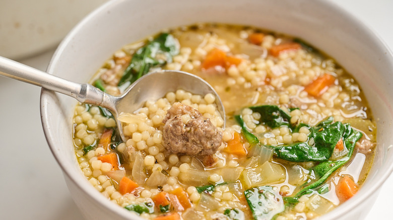 meatball on a spoon in soup