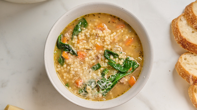 Bowl of italian wedding soup on table