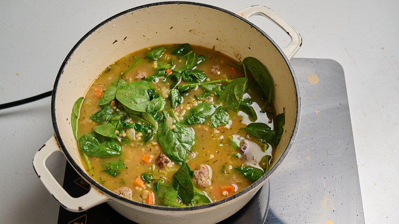 cooking spinach in a pot