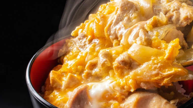 finishing oyakodon on rice