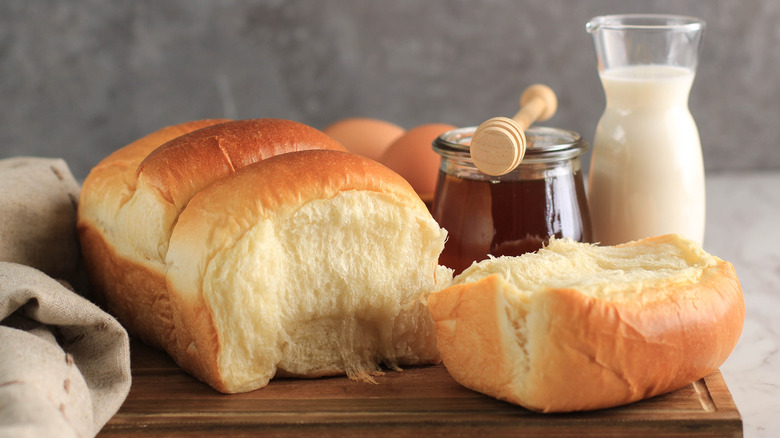 Japanese milk bread shokupan next to honey