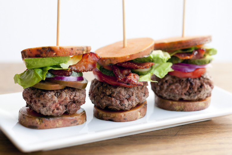 These Paleo bacon avocado burger sliders sub in healthy roasted sweet potato slices for buns.