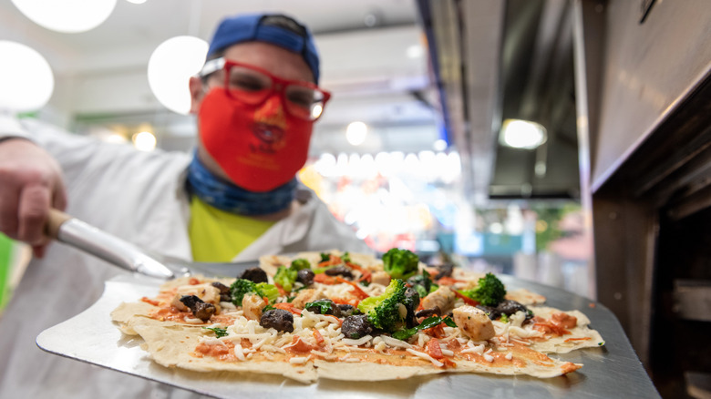 Brandon Fay making pizza