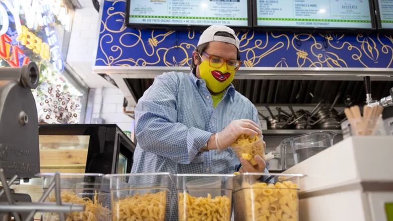 Brandon Fay loading containers with freshly made pasta