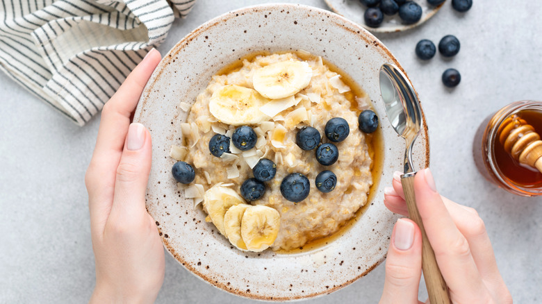 A bowl of oatmeal with fruits