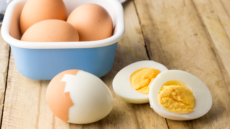 hard-boiled eggs in shell and sliced open