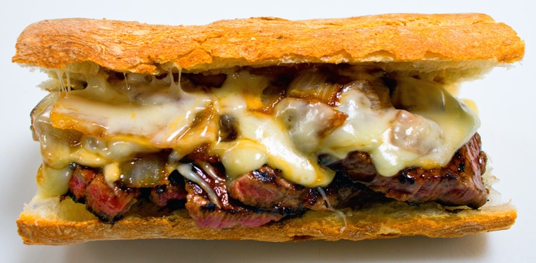 Pat LaFrieda's filet mignon sandwich contains Monterey jack cheese, sweet onions, and is served au jus on a toasted baguette.