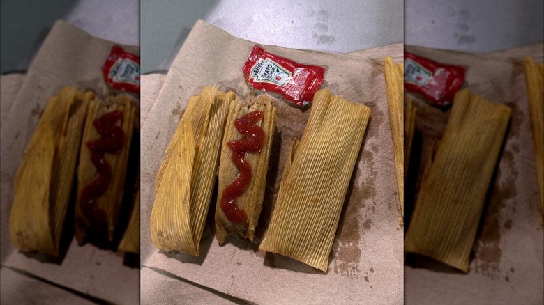 Ketchup on top of tamales.