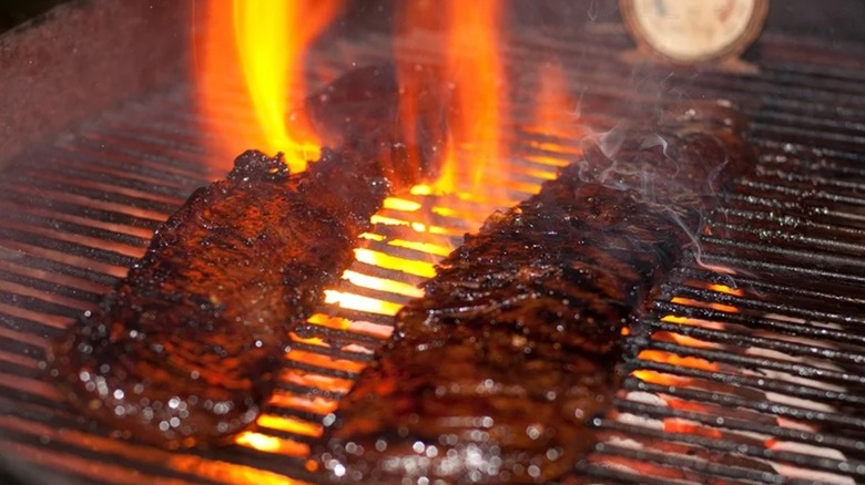steak cooking on the grill