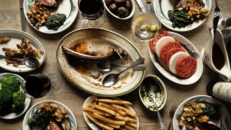 Finished meal at Peter Luger Steak House with dirty plates