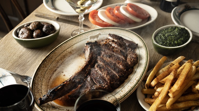 Table filled with food at Peter Luger Steak House
