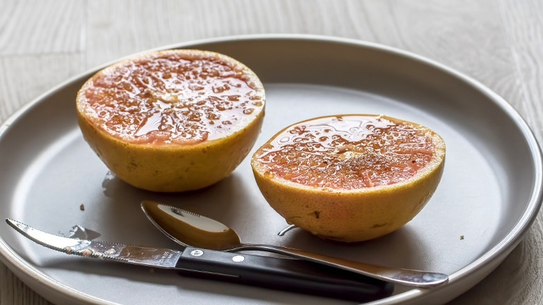 Grapefruit and knife