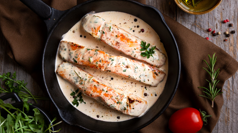 Salmon in cream in pan