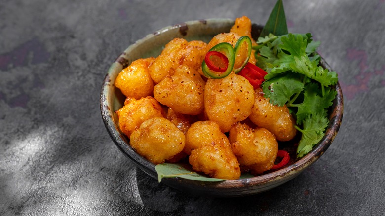 A bowl of tempura-battered popcorn shrimp