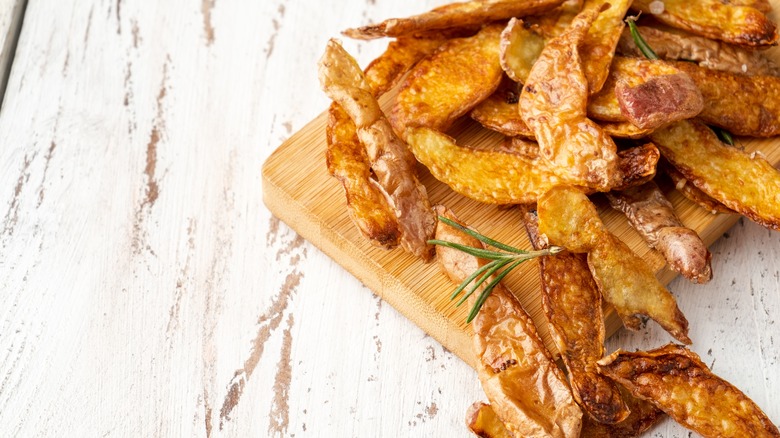 crispy potato peels on board