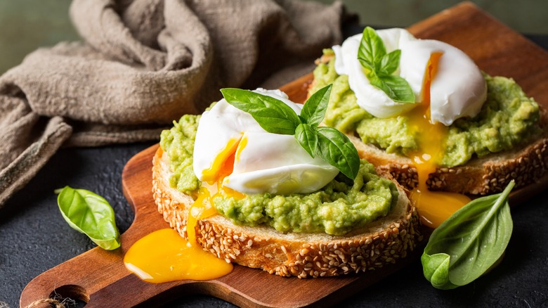 Avocado toast on a cutting board