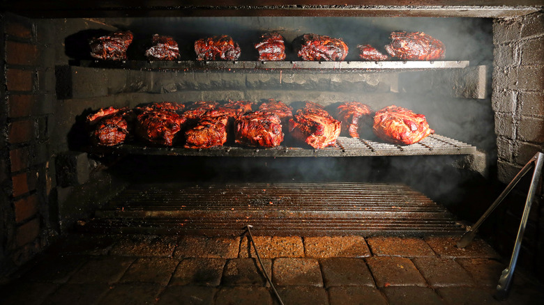 pork being smoked over hickory
