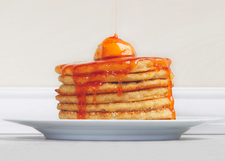 Top scrumptious dosa-inspired pancakes with kimchi-infused honey for a sweet and savory brunch.