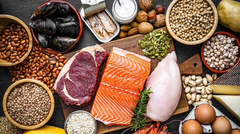 A wide array of protein-rich foods sits on a table