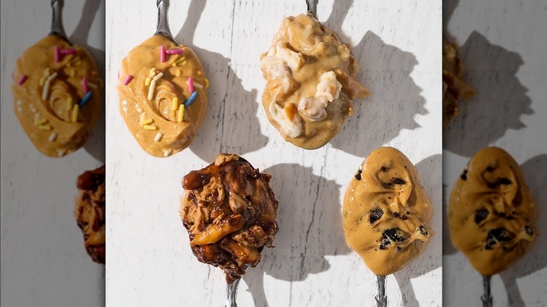 Four flavors of nuts n more peanut butter on spoons