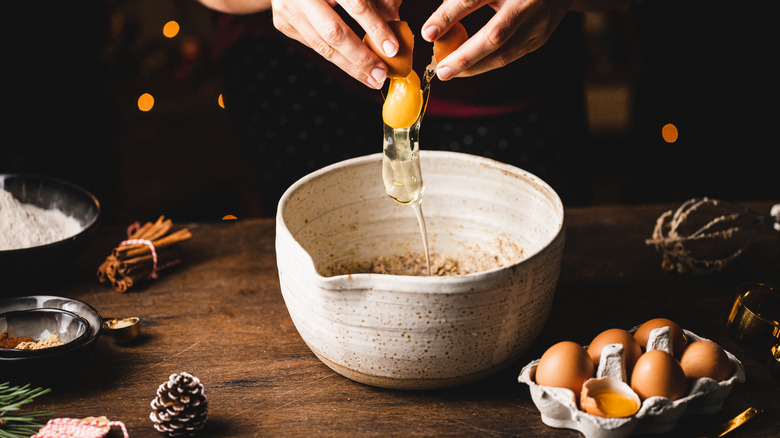 An egg cracked into a bowl