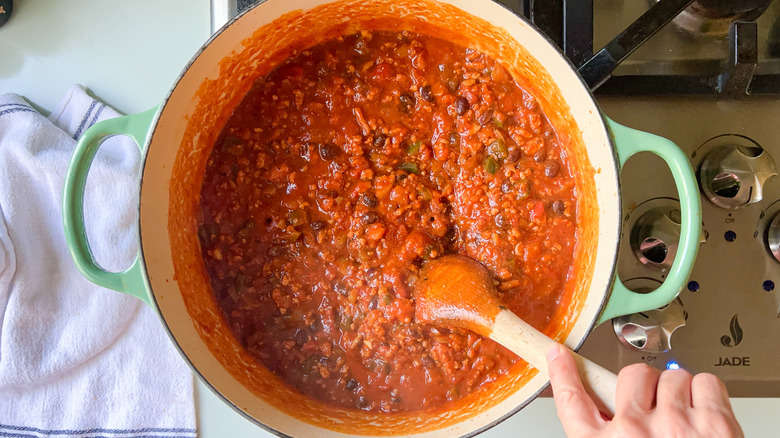 Pumpkin and turkey chili in pot on stove