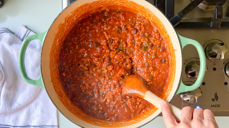 Pumpkin and turkey chili in pot on stove