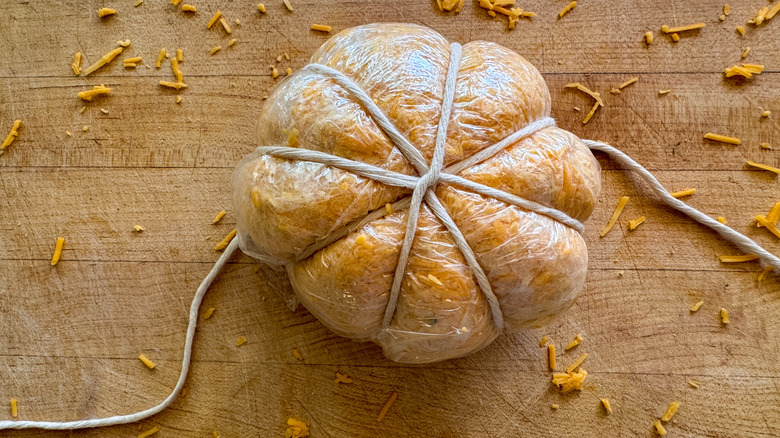 cheese ball wrapped with twine